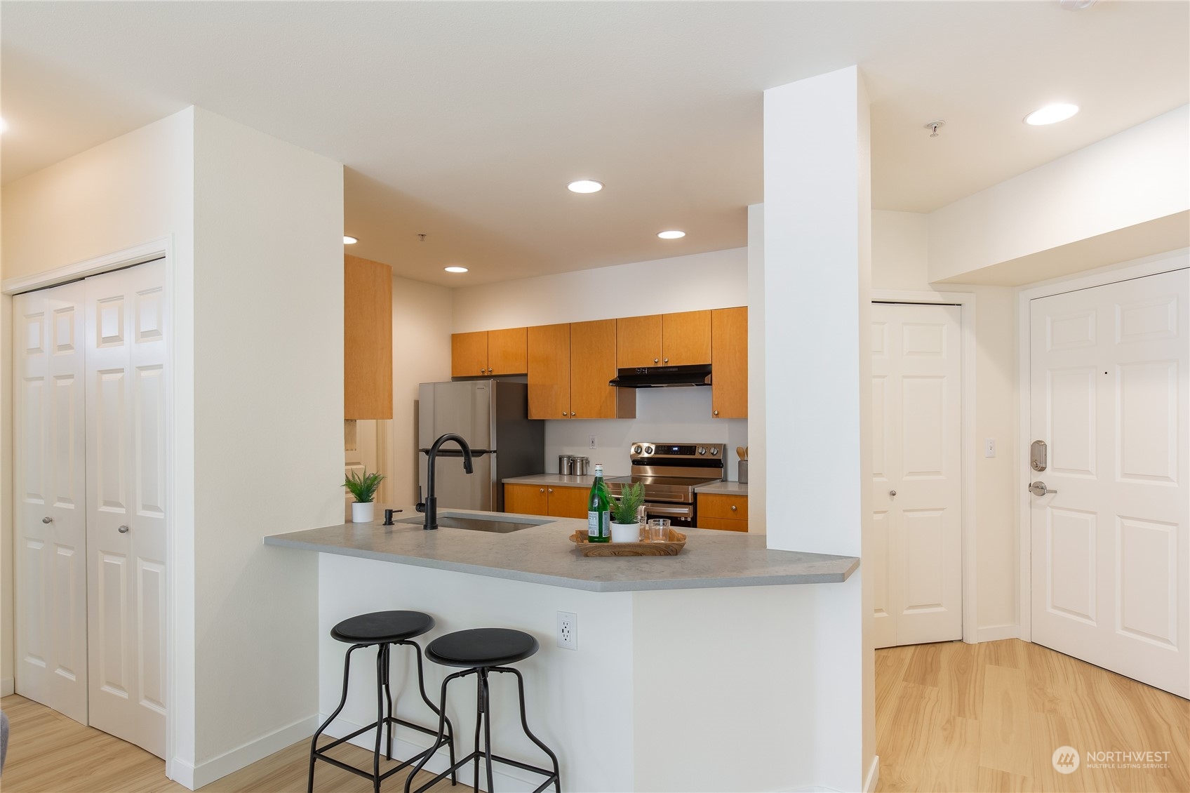 18 Dravus Street, Unit 210 Seattle, WA 98109 - Photo 22 of 38 a kitchen with a sink appliances and cabinets