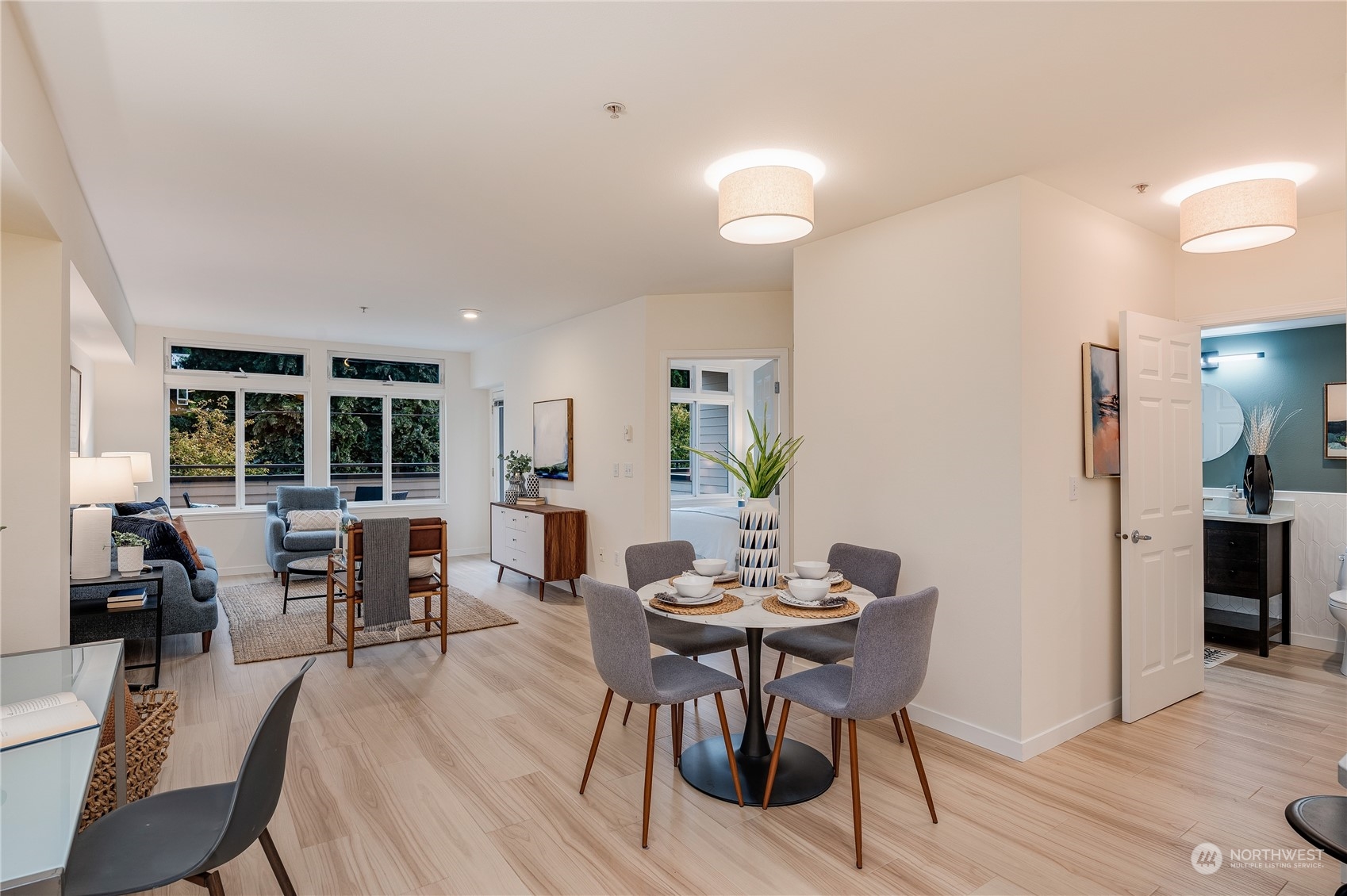 18 Dravus Street, Unit 210 Seattle, WA 98109 - Photo 3 of 38 a view of a dining room with furniture and wooden floor