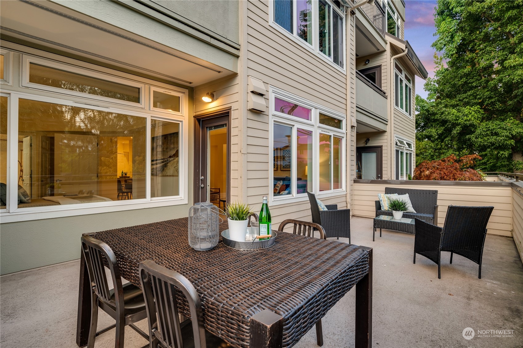 18 Dravus Street, Unit 210 Seattle, WA 98109 - Photo 7 of 38 a view of a patio with table and chairs and potted plants