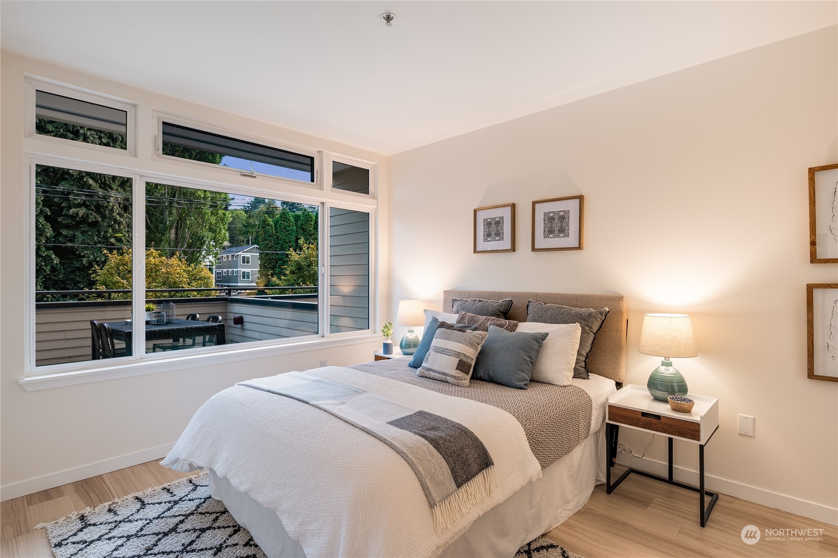 18 Dravus Street, Unit 210 Seattle, WA 98109 - Photo 8 of 38 a bedroom with a large bed and a large window