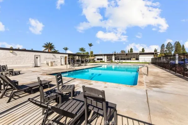 a view of a swimming pool with seating area