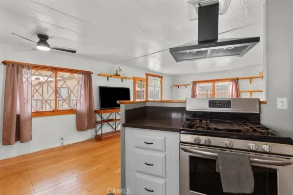 a kitchen with stainless steel appliances granite countertop a stove and a sink