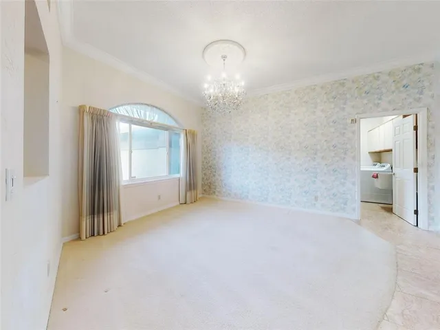 a view of an entryway with a chandelier