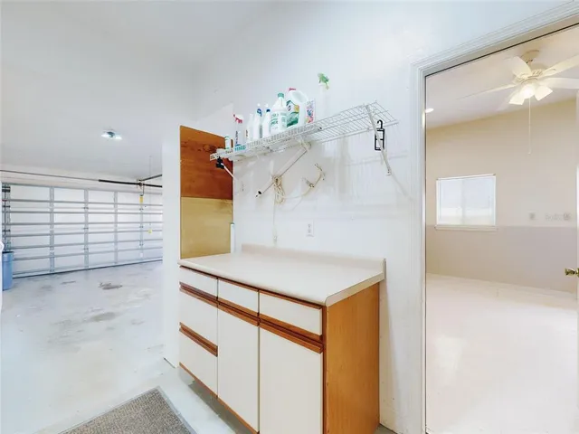 a view of an empty room with a fireplace