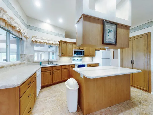 a bathroom with a tub a sink and mirror