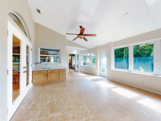 a view of a hallway with wooden shelves