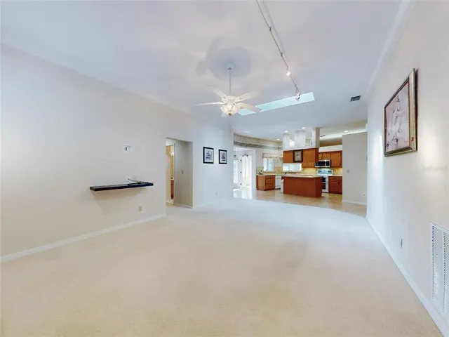 a spacious bathroom with a double vanity sink mirror and bathtub