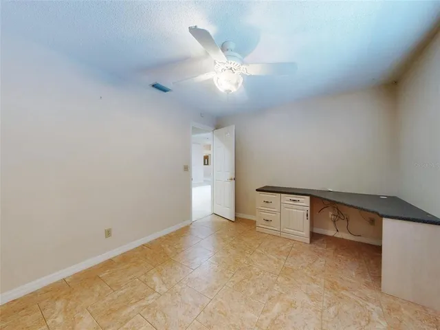 a front view of house with yard and trees