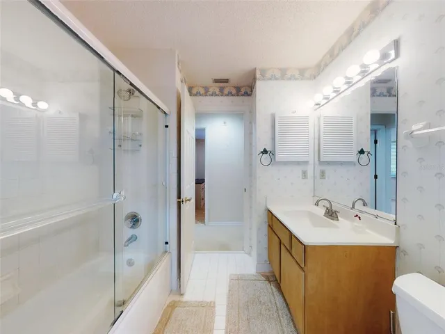 a view of a house with swimming pool and a yard