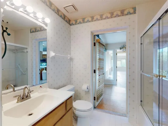 a front view of house with a garden