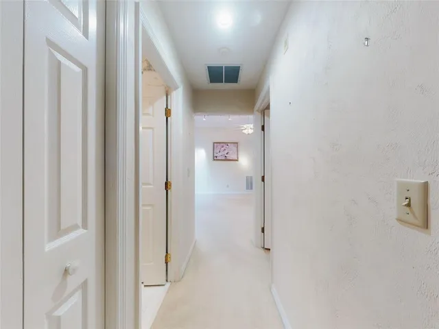 an aerial view of residential houses with outdoor space and swimming pool