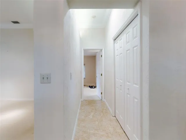 an aerial view of a house with a garden and lake view