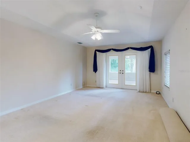 an aerial view of a house with swimming pool garden and patio