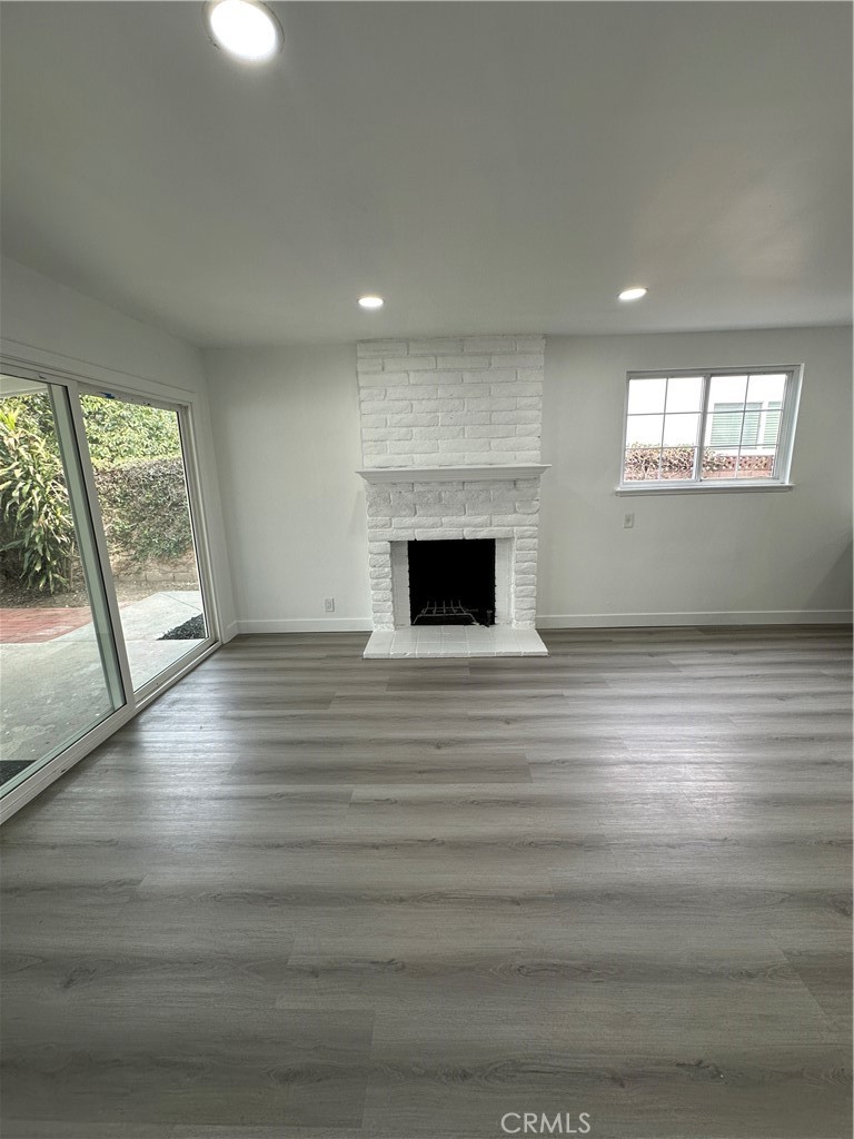 1021 Gaillard Street Azusa, CA 91702 - Photo 15 of 24 an empty room with wooden floor and windows