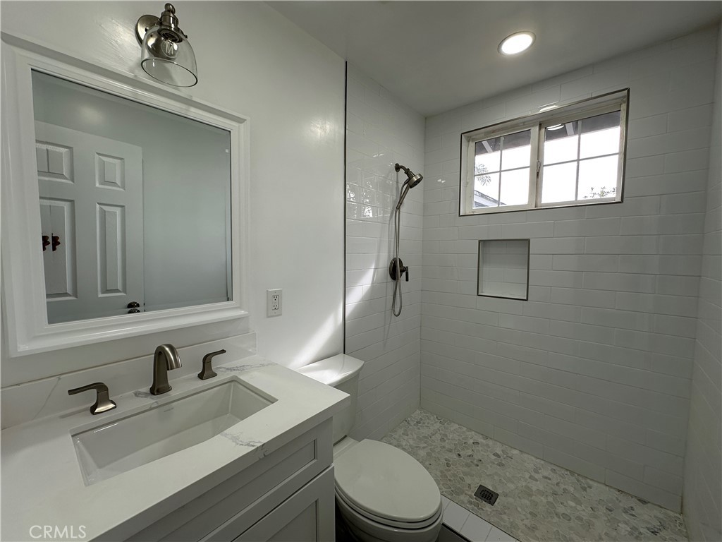 1021 Gaillard Street Azusa, CA 91702 - Photo 18 of 24 a bathroom with a sink a toilet and shower