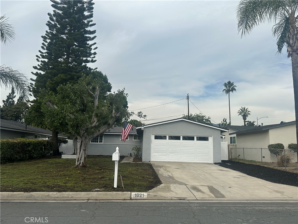 1021 Gaillard Street Azusa, CA 91702 - Photo 24 of 24 a front view of a house with a yard and garage