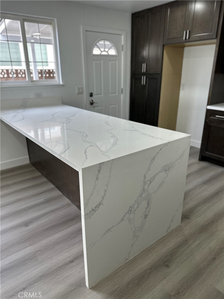 1021 Gaillard Street Azusa, CA 91702 - Photo 3 of 24 a view of a kitchen cabinets and wooden floor