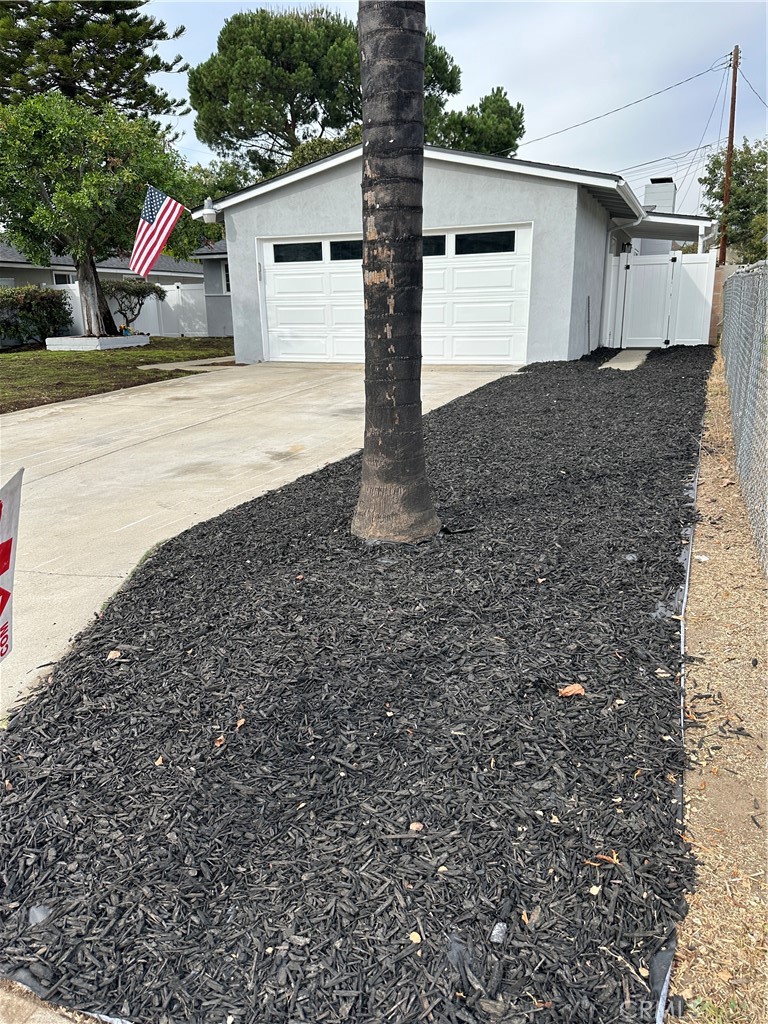 1021 Gaillard Street Azusa, CA 91702 - Photo 4 of 24 a front view of a house with a yard and garage