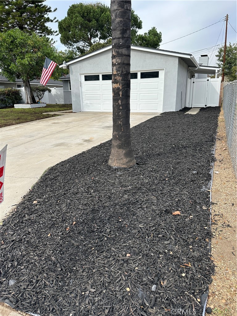 1021 Gaillard Street Azusa, CA 91702 - Photo 7 of 24 a front view of a house with a yard and garage