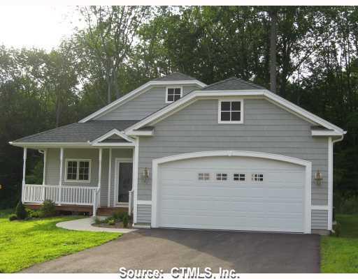 61 Buttonwood Road, Unit 33 Hebron, CT 06248 - Photo 1 of 1 a front view of a house with a yard