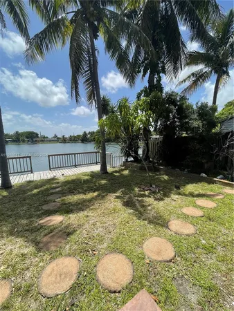a view of a water pond with green space
