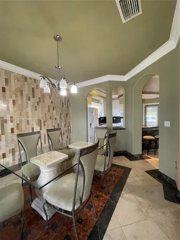 a view of a livingroom with furniture and a chandelier