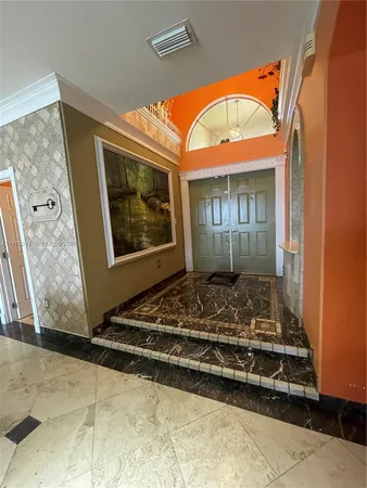 a room with a door and a rug