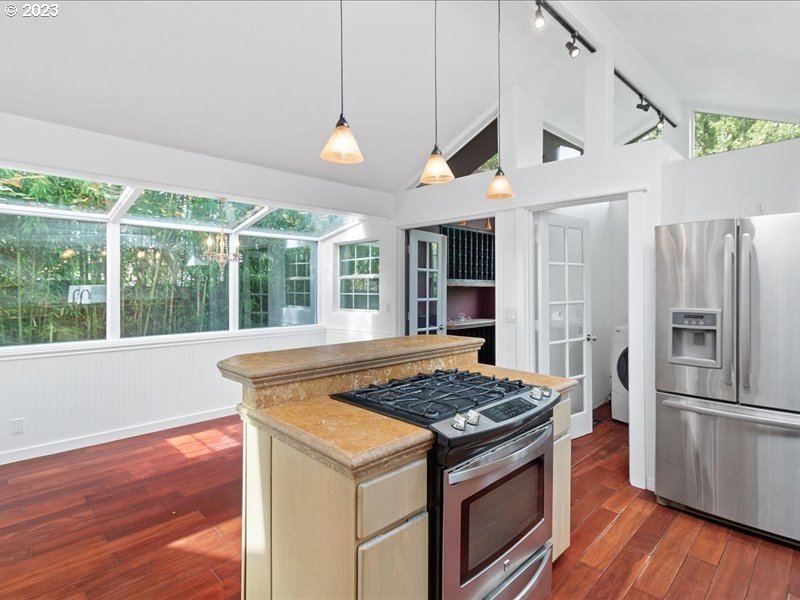 4155 Mapleton Drive West Linn, OR 97068 - Photo 11 of 38 a kitchen with a stove and a refrigerator