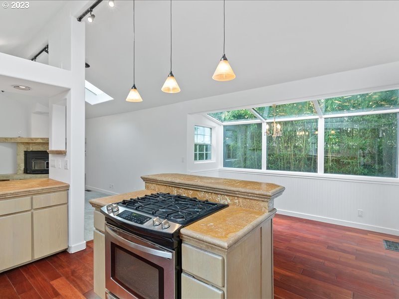 4155 Mapleton Drive West Linn, OR 97068 - Photo 12 of 38 a kitchen that has a stove and a wooden floor
