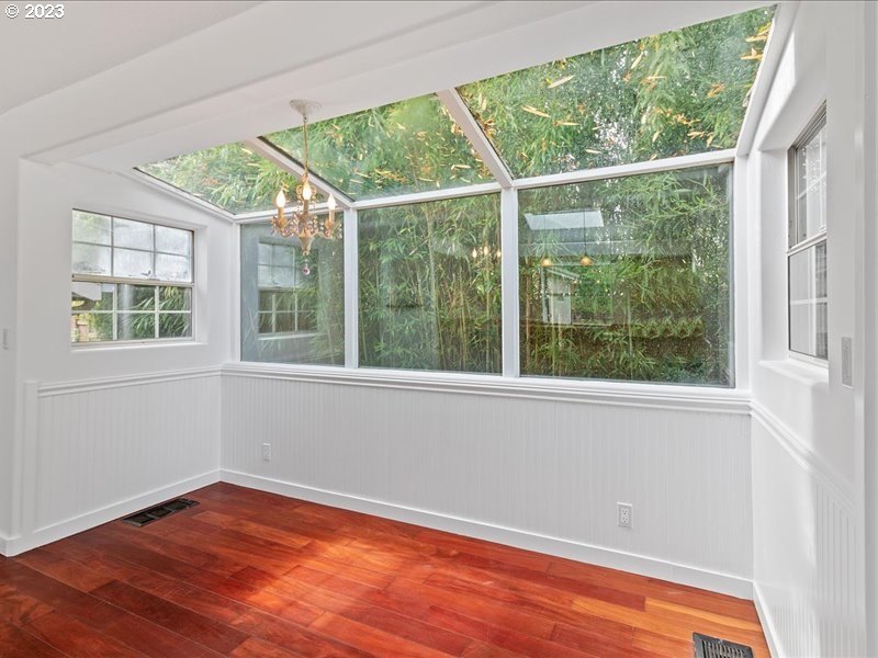 4155 Mapleton Drive West Linn, OR 97068 - Photo 16 of 38 a view of an empty room with wooden floor and a window