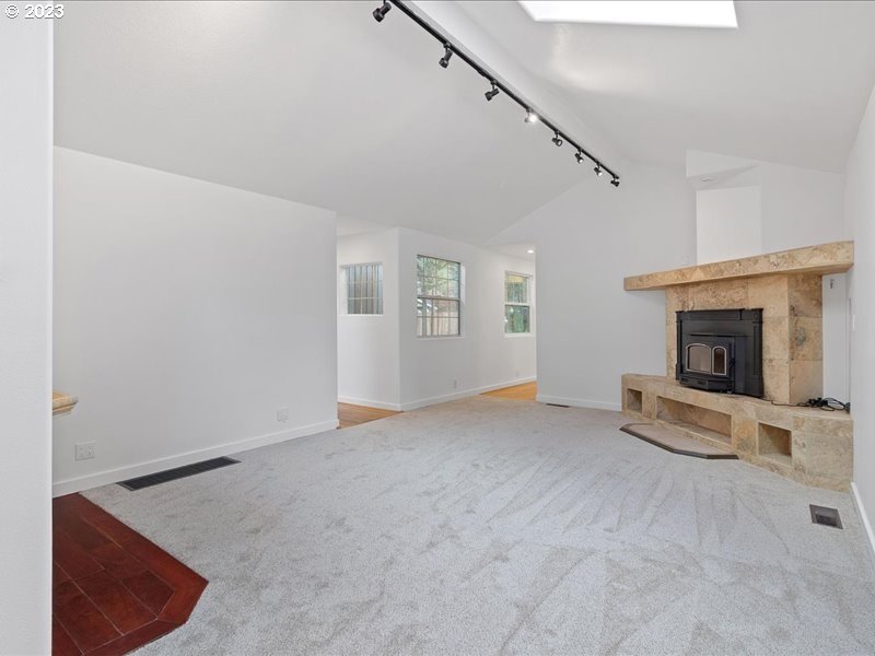 4155 Mapleton Drive West Linn, OR 97068 - Photo 17 of 38 a view of an empty room with window and fireplace