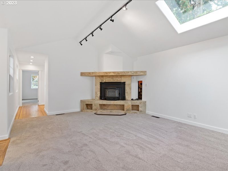 4155 Mapleton Drive West Linn, OR 97068 - Photo 19 of 38 a view of an empty room with a fireplace and a window