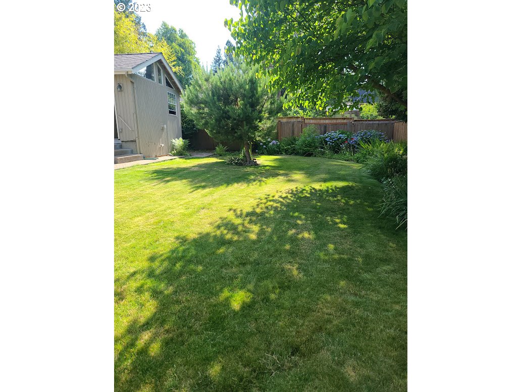 4155 Mapleton Drive West Linn, OR 97068 - Photo 32 of 38 a backyard of a house with lots of green space