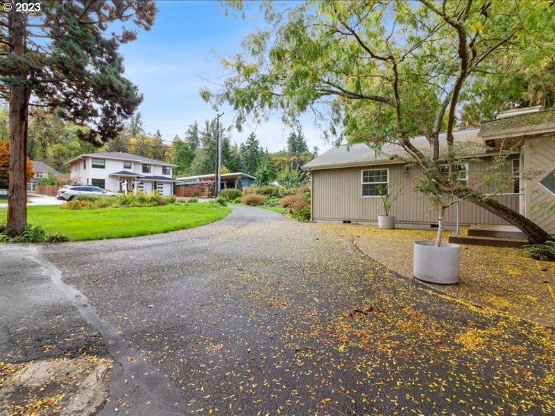 4155 Mapleton Drive West Linn, OR 97068 - Photo 5 of 38 a view of a house with a yard and large trees