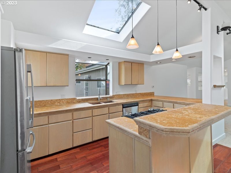 4155 Mapleton Drive West Linn, OR 97068 - Photo 10 of 38 a kitchen with a sink cabinets and wooden floor