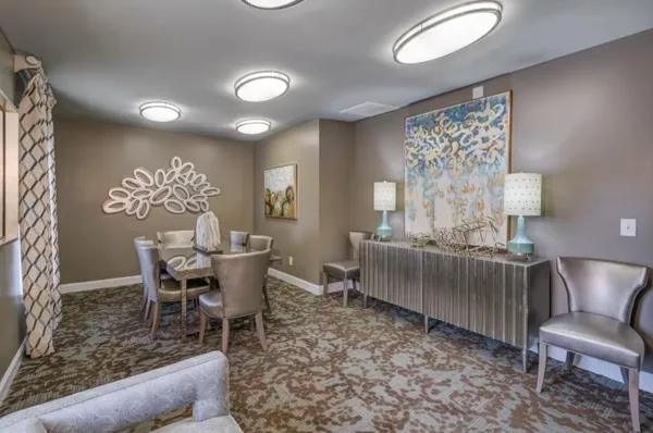 a dining room with furniture and window