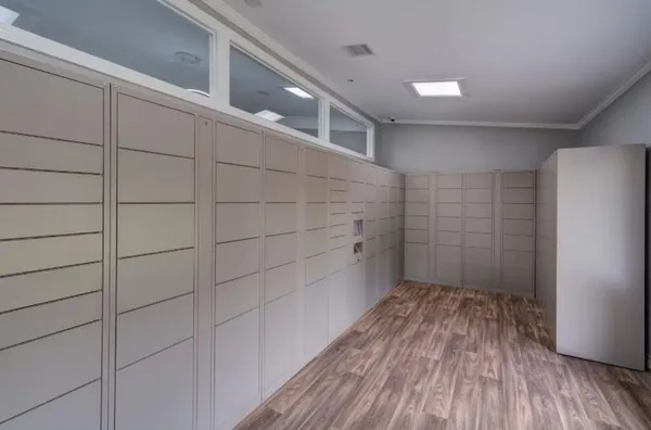 a room with a walk in closet and wooden floor