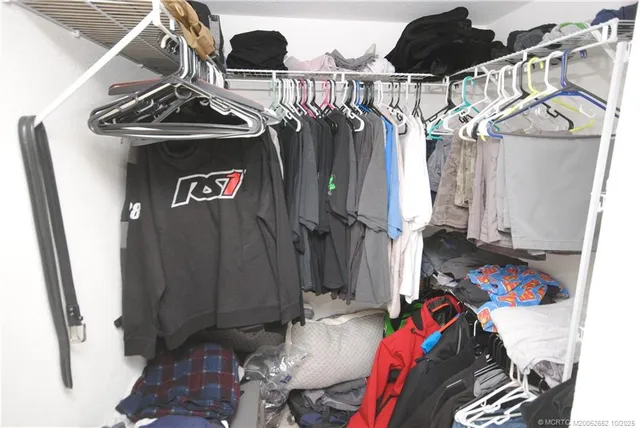 a front view of a house with plants