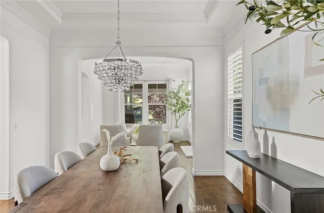 a living room with furniture a large window and a fireplace
