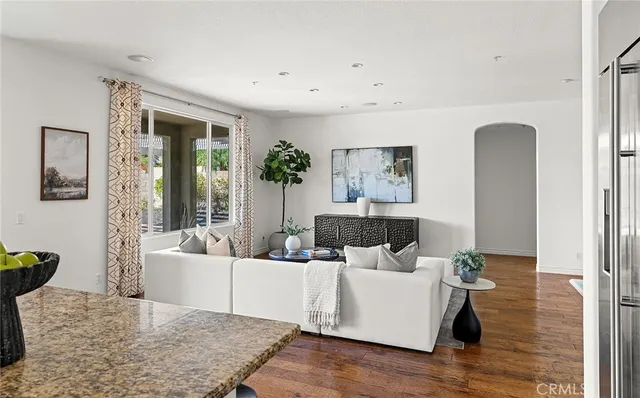 a bathroom with a toilet sink vanity and mirror