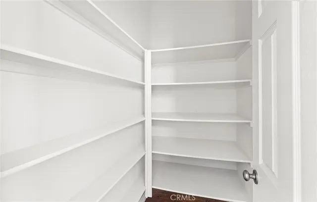 a living room with furniture and a book shelf