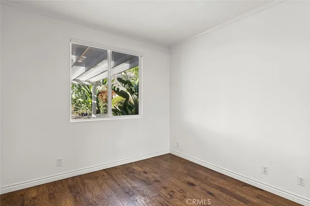 a view of a hallway with windows and stairs