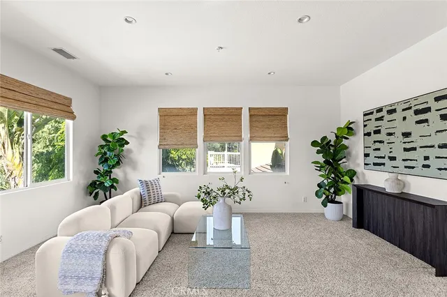 a bathroom with a bathtub sink and mirror