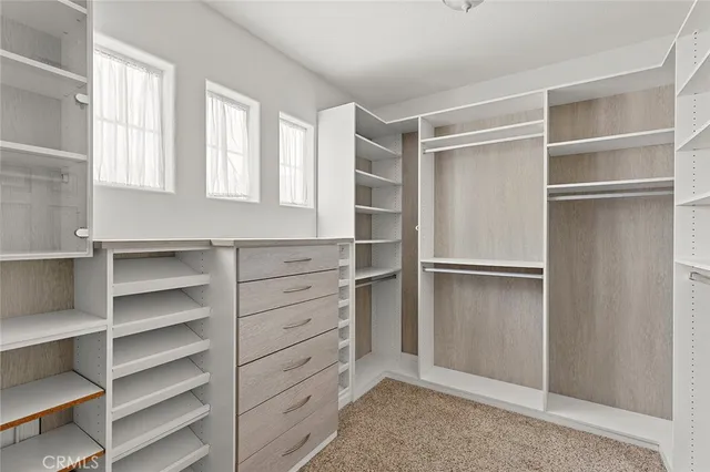 a kitchen with white cabinets and a sink