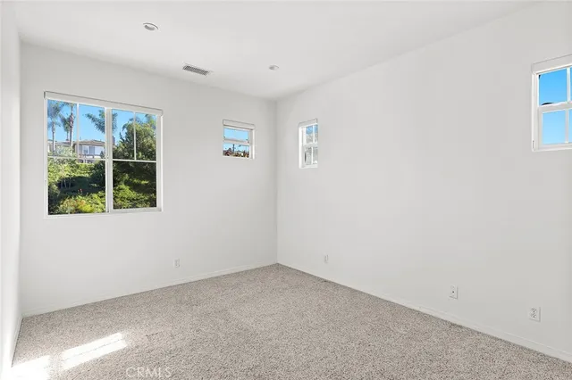 a view of a balcony with an outdoor space and seating area