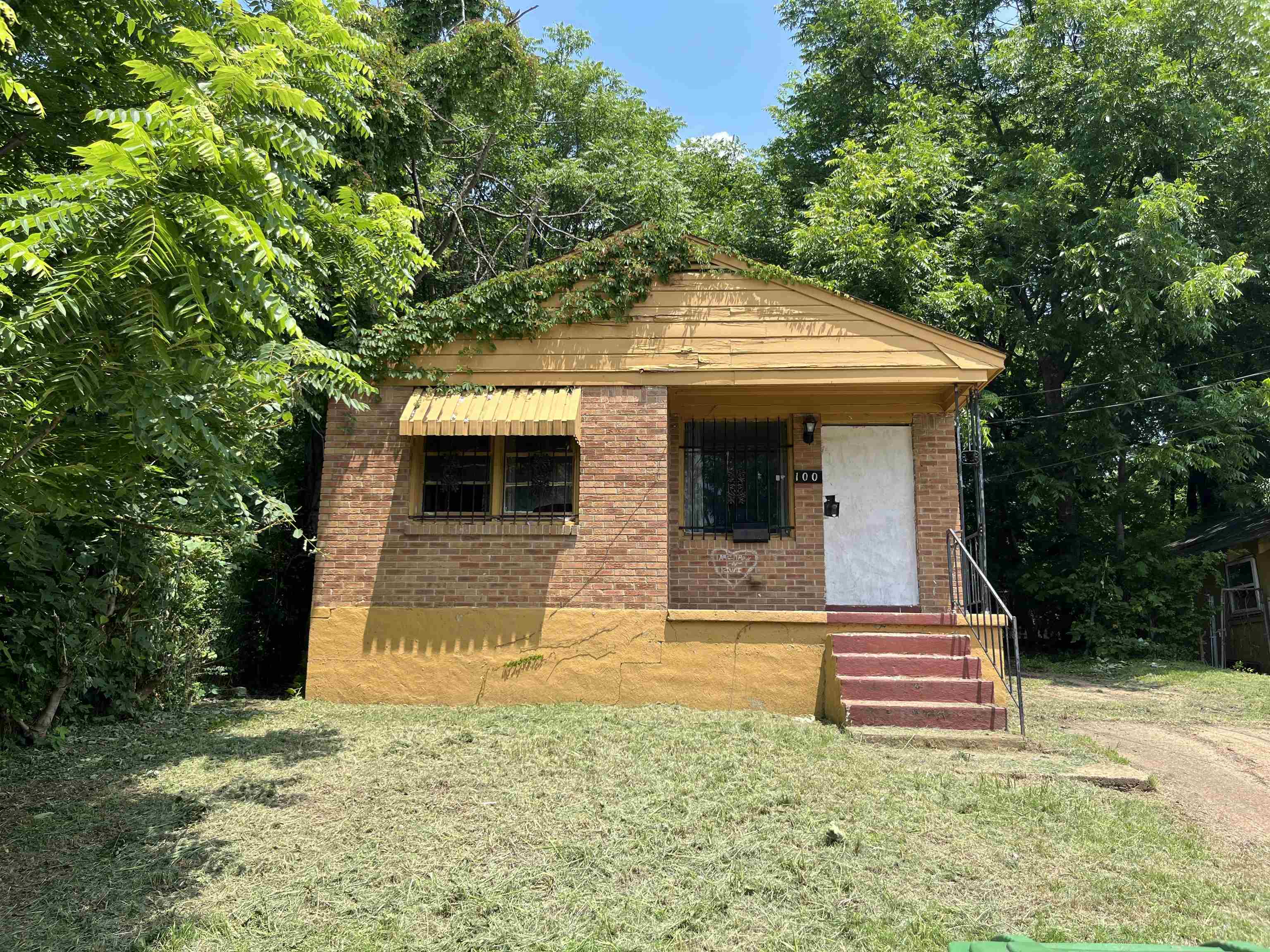 100 Silverage Avenue Memphis, TN 38109 - Photo 1 of 30 Brick facade residence with a gabled roofline and front porch