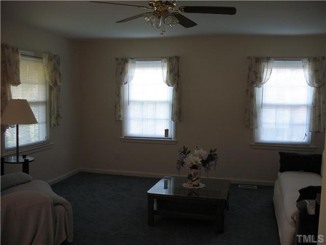 2339 Kennington Road Raleigh, NC 27610 - Photo 3 of 3 a living room with furniture and a window