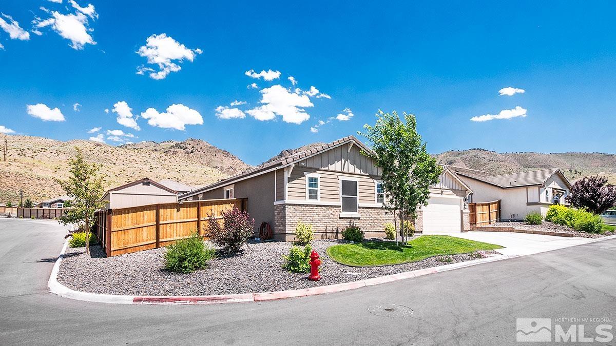 10310 Palladium Mine Drive Reno, NV 89521 - Photo 3 of 35 a front view of a house with a yard