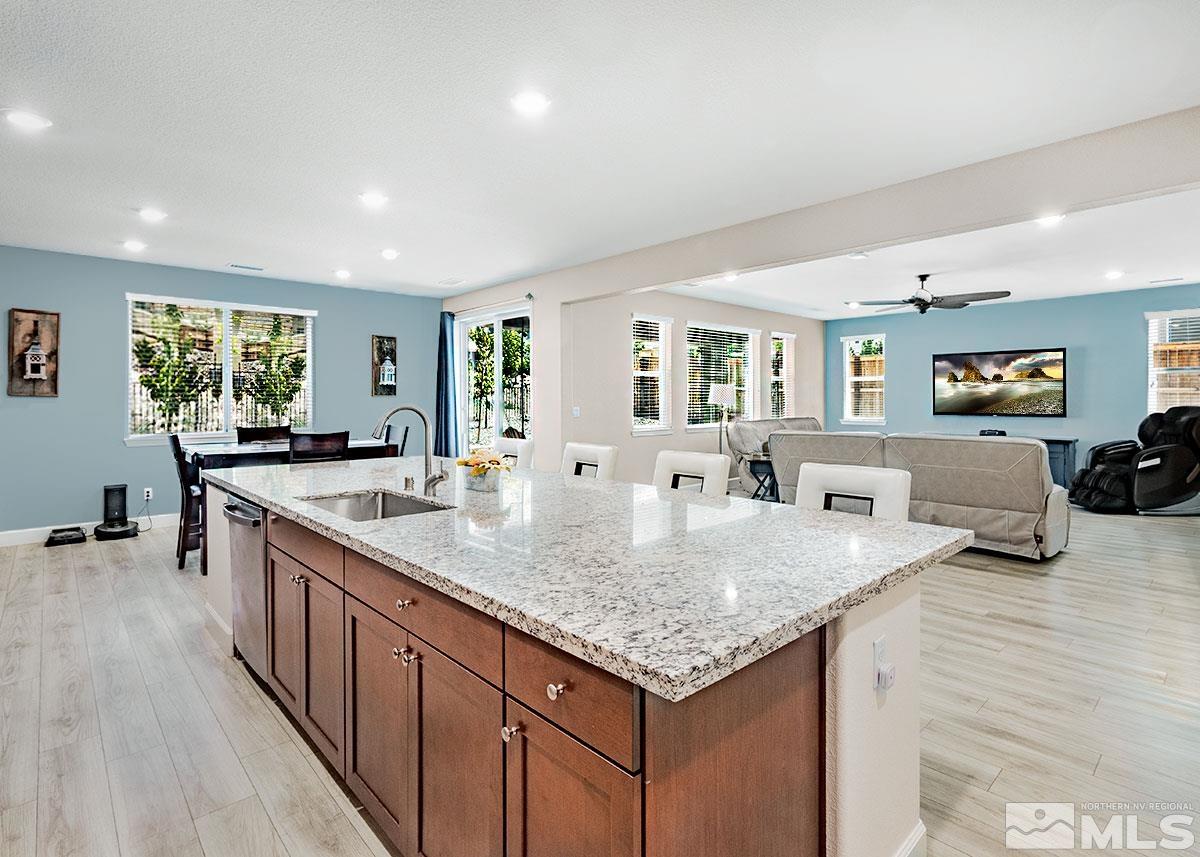 10310 Palladium Mine Drive Reno, NV 89521 - Photo 4 of 35 a kitchen with granite countertop a sink and counter space