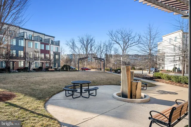 a view of a swimming pool with outdoor seating